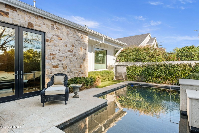 pool in corner of backyard