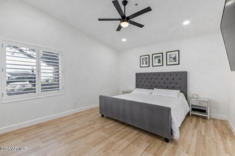 Modern minimalist bedroom with greenery