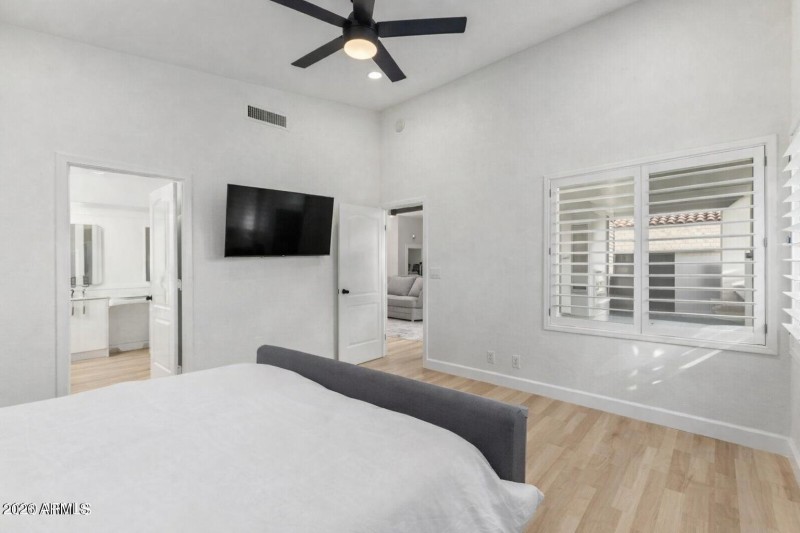 Modern bedroom with bathroom doorway