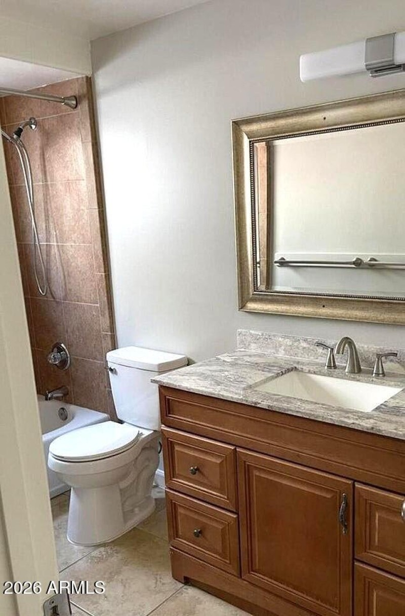 Full bathroom with tub & shower.