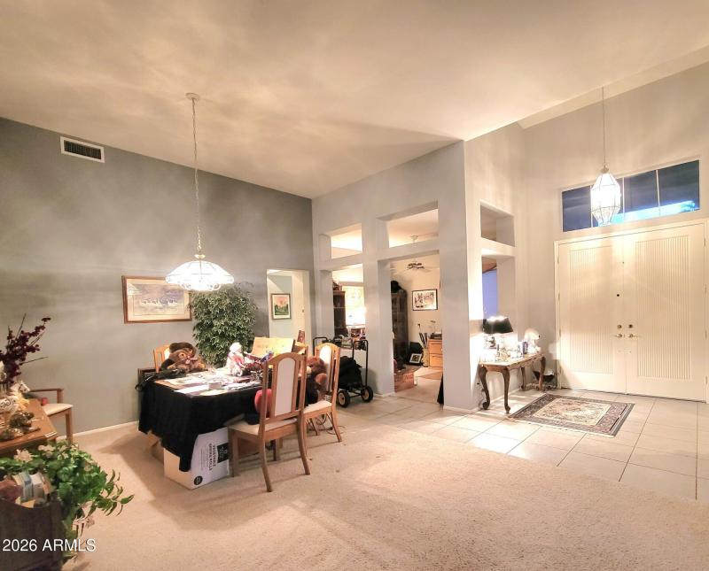 Foyer, dining, den, entrance to hall