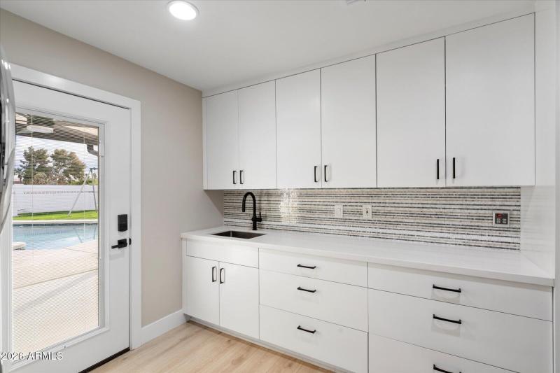 Laundry Room w Built In Cabinets