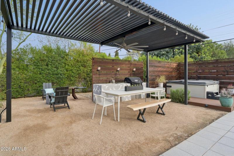 Poolside outdoor kitchen + hot tub deck