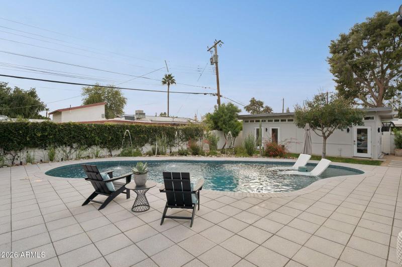 Shellock pavers extend to covered patio