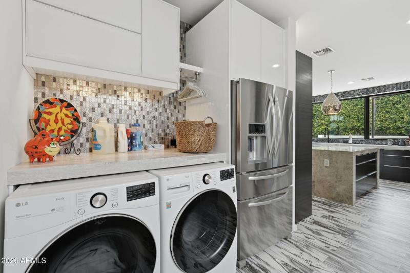 Laundry w/ Mosaic Tile Backsplash