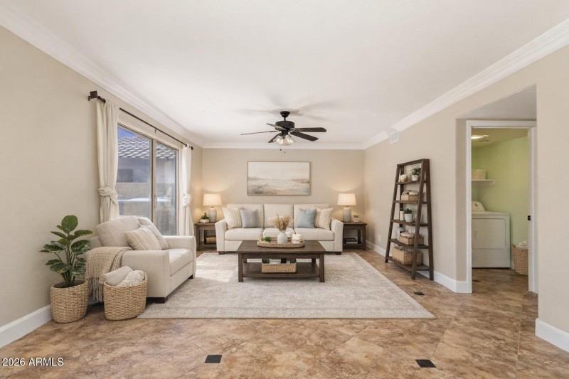 Bright and airy living room with laundry