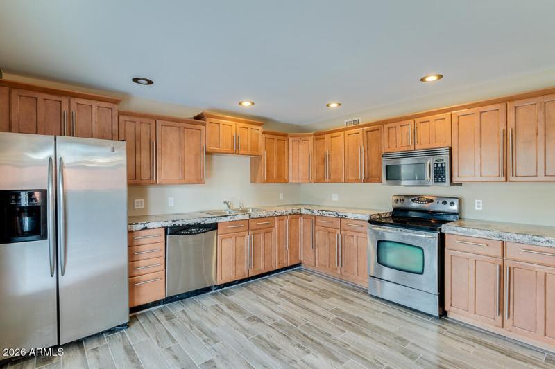 8. GOURMET KITCHEN WITH STAINLESS STEEL