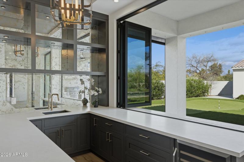 Media Bar Opens to Outdoor Patio