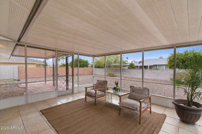 Screened in patio off of kitchen