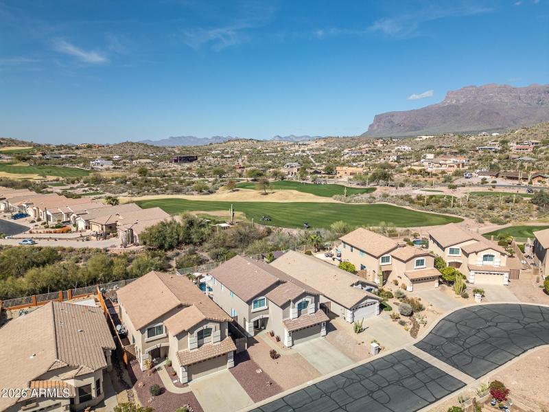 Drone view of golf course and mountains