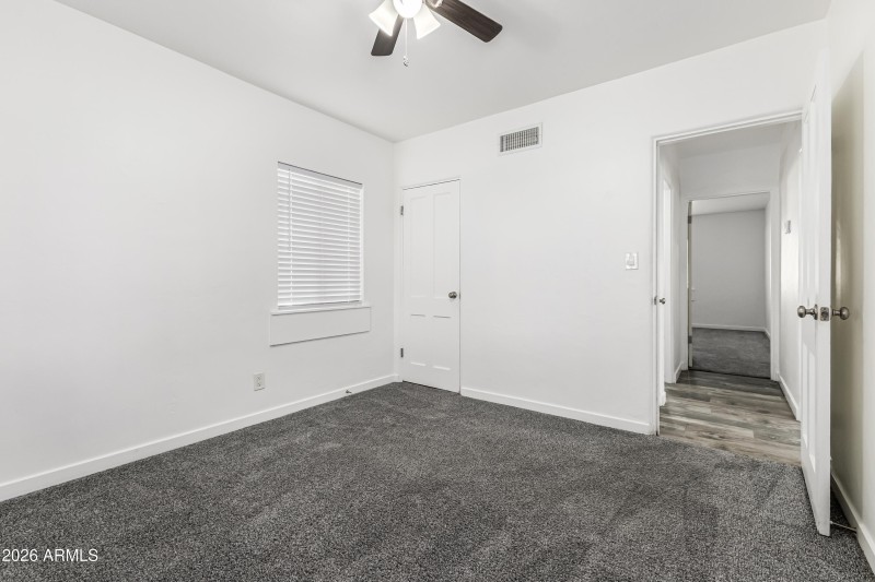 BEDROOM LOOKING INTO HALLWAY