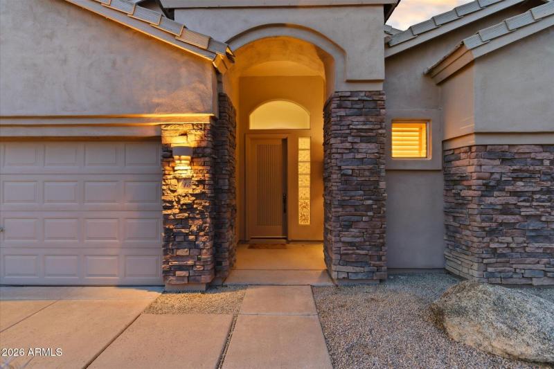Entry w Stone Columns & Arched Walkway