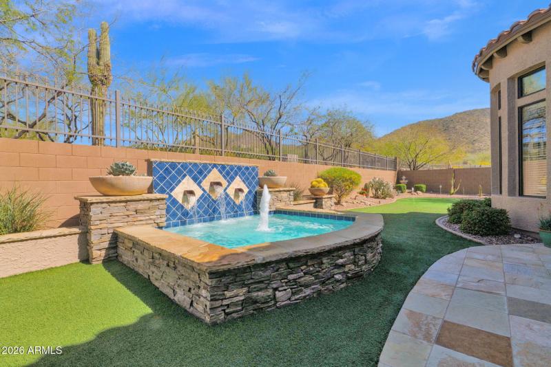 Spa/water feature with mountain views
