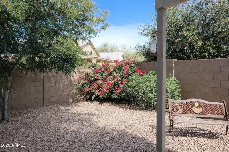 Backyard patio with bright bougainvillea