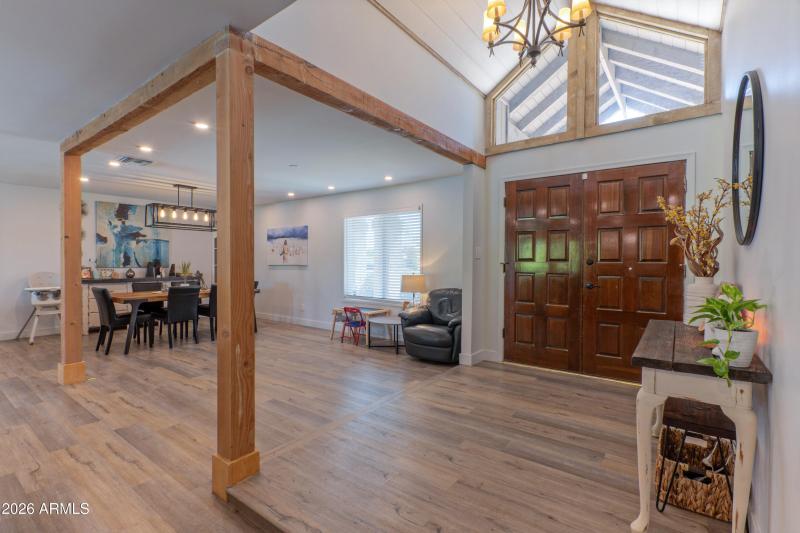 Entry with sunny vaulted ceiling