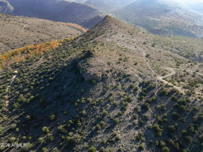 Knoll w shot of trail and road