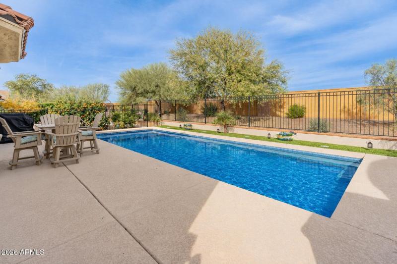 Serene backyard with vibrant swimming po