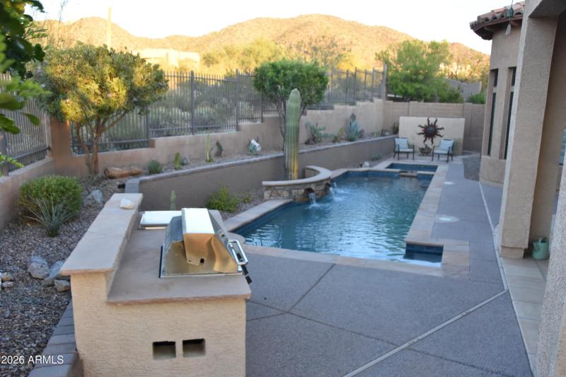 bbq and pool from patio looking east
