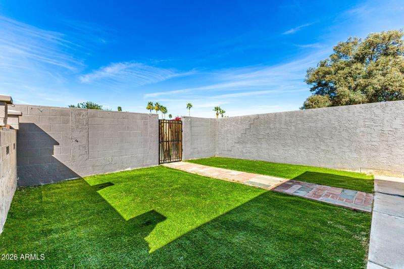 Synthetic lawn near alley exit