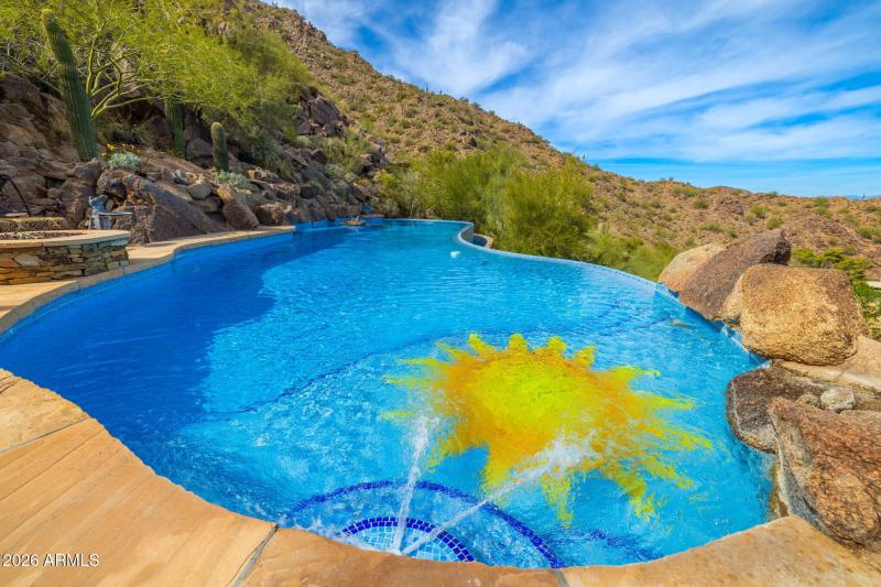 A Mosaic Sun Adorns the Pool