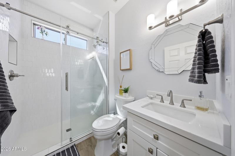 main bathroom with barn style glass door