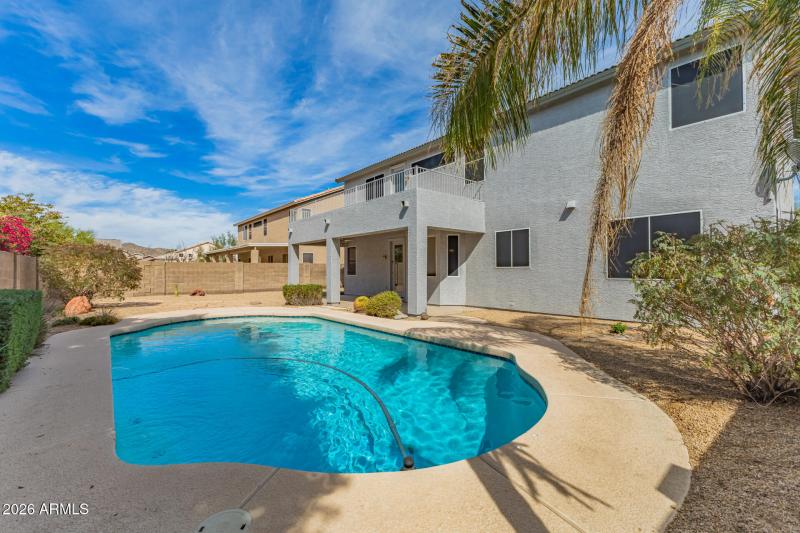 Large backyard with sparkling pool