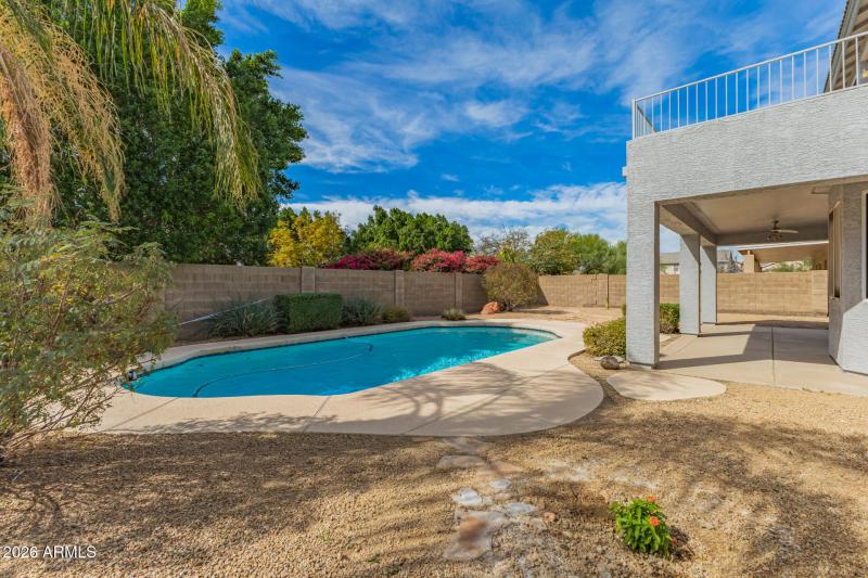 Large backyard with sparkling pool