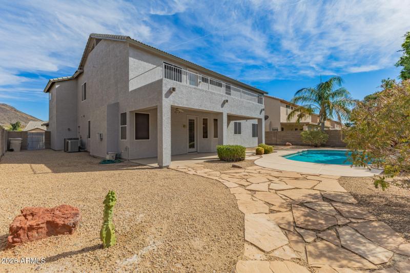 Large backyard with sparkling pool