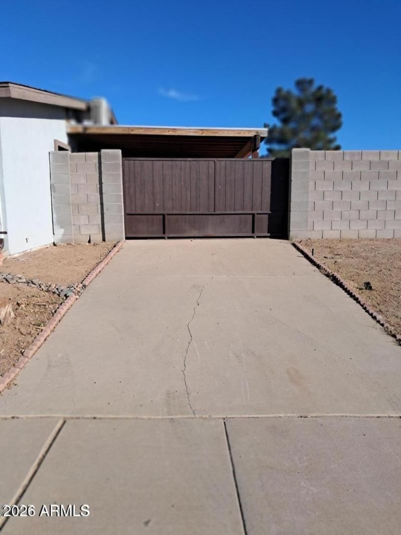Gated to carport