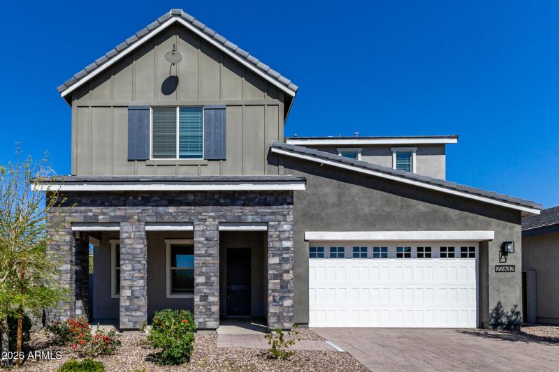 Front with 3 car tandem garage