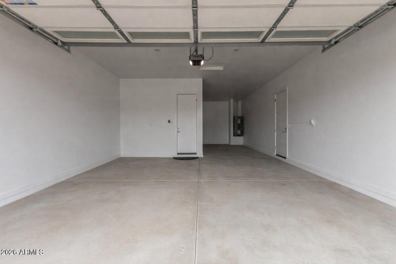 spacious garage with white walls (1)