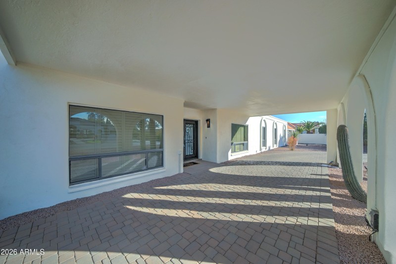 Front covered driveway-front door
