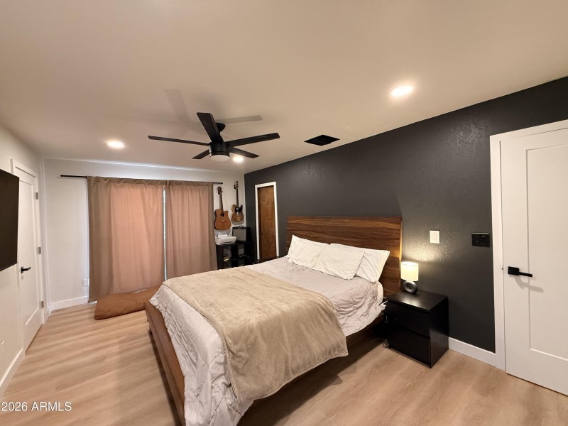 Primary bedroom with 2 walk-in closets