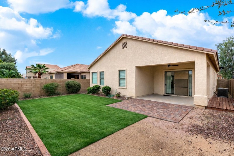 Sunny suburban backyard with patio