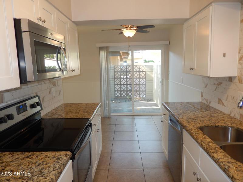 Unit 2 - Kitchen-Dining-Door to Patio