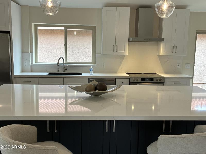 kitchen with island and stainless steel