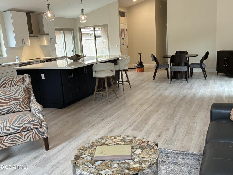 living room, kitchen island and eat-in d