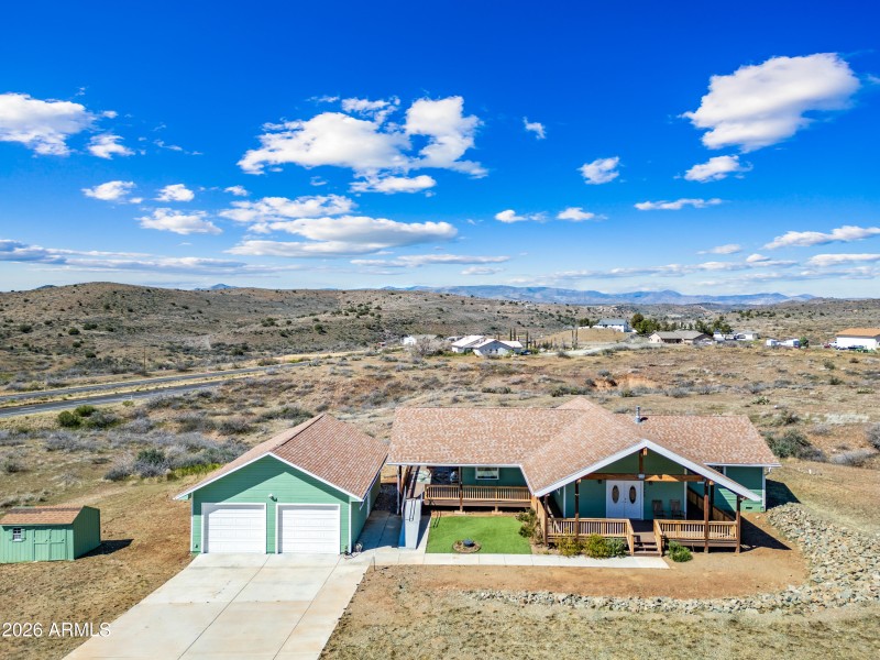 Front view of home and oversized garage