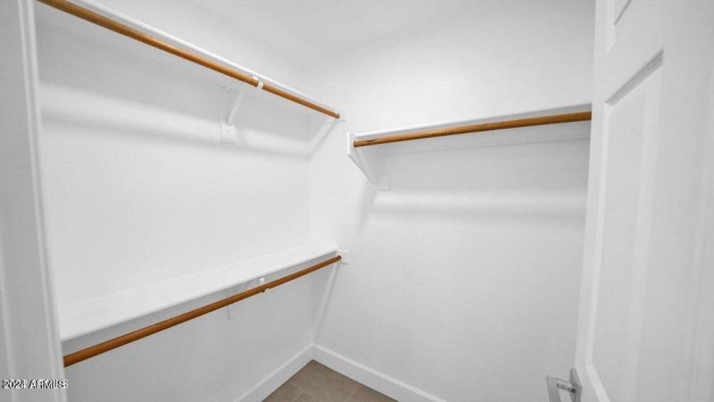 WALK IN CLOSET IN MASTER BEDROOM