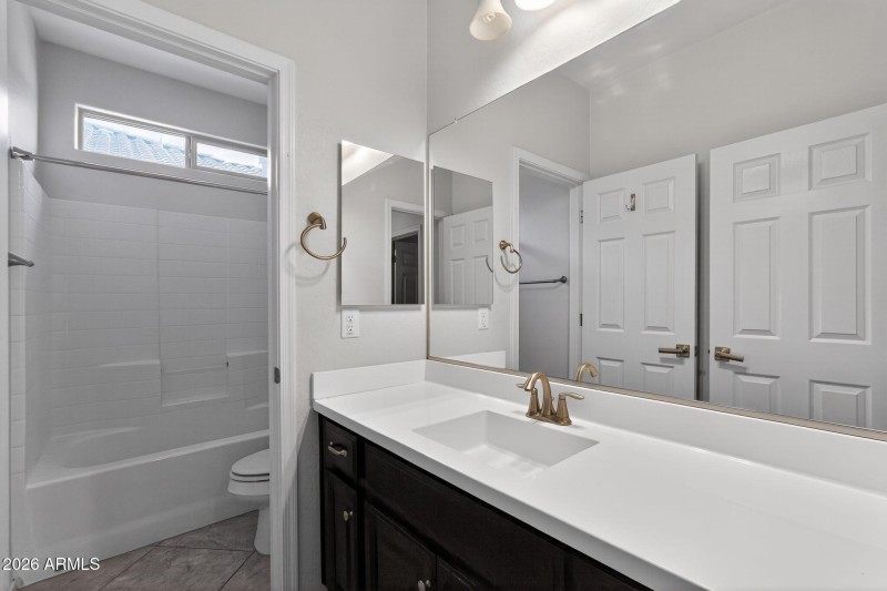 Clean and bright secondary bathroom