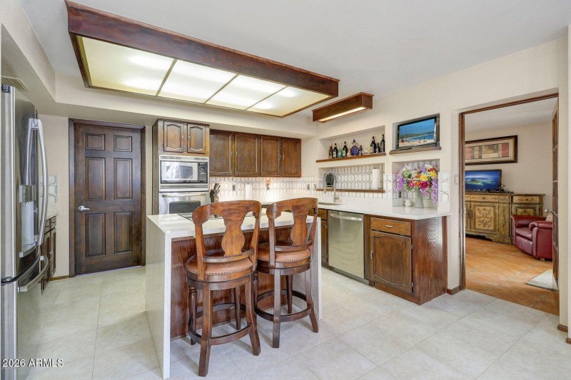 kitchen with quartz counter and waterfal