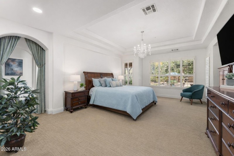 Primary Bedroom with backyard view