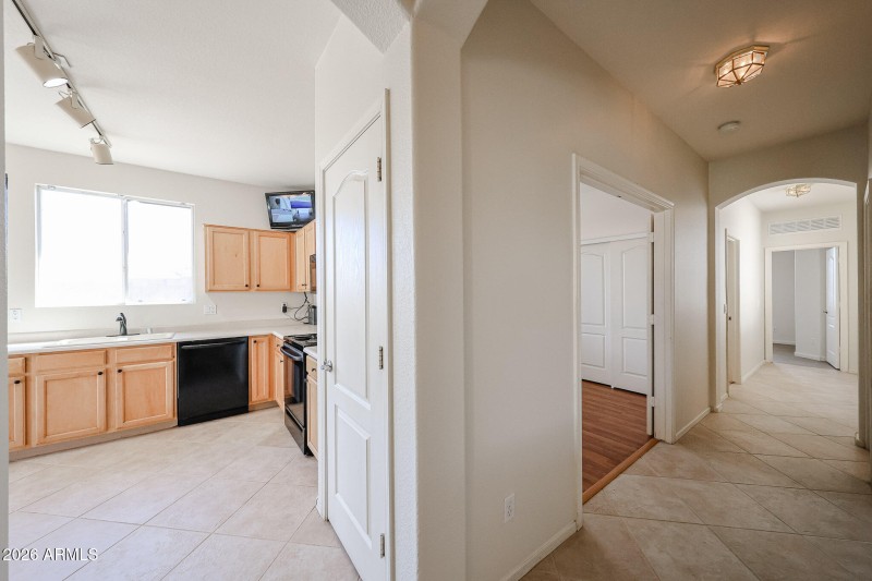 entryway hall to kitchen and guest beds
