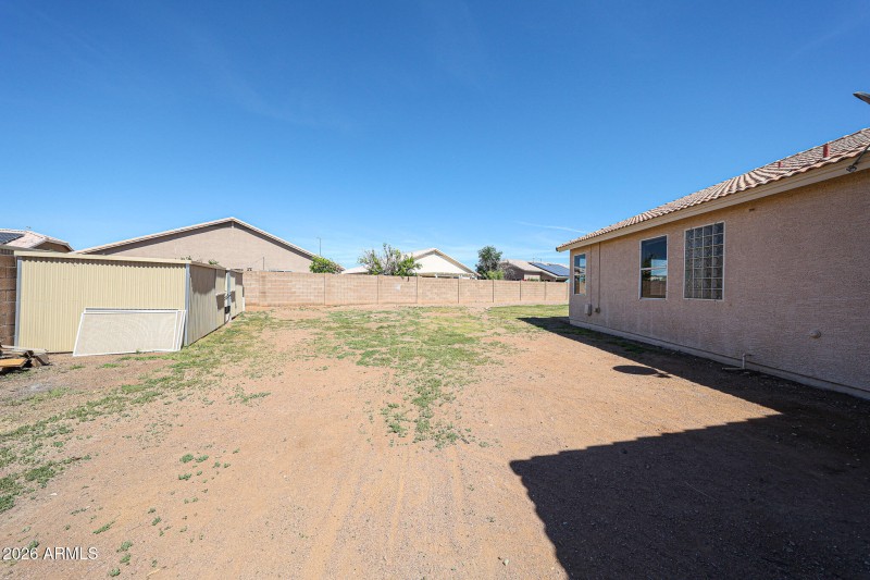 RV side of the yard with storage