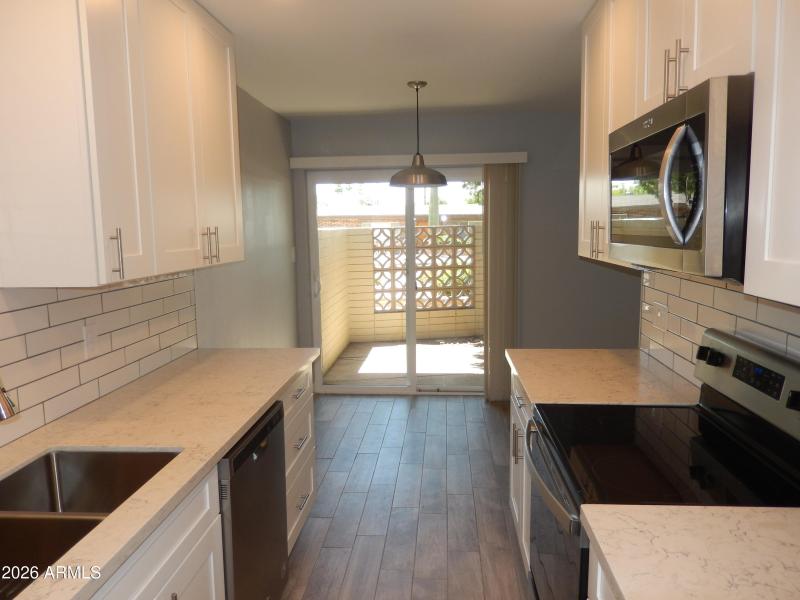 Kitchen/Dining Area/Private-Fenced Patio