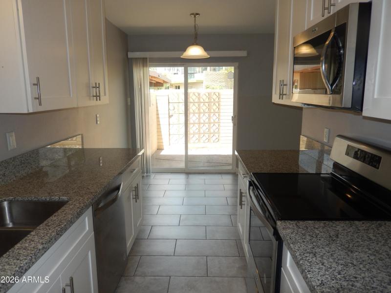 Unit 3 - Kitchen, Dining Area & Patio