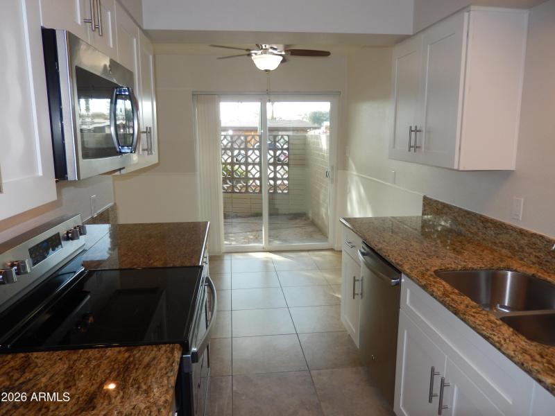 Unit 4 - Kitchen, Dining Area & Patio