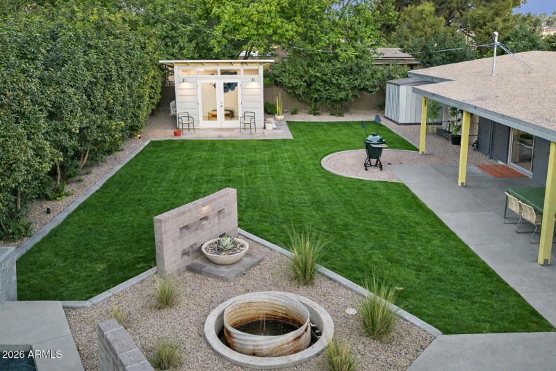 Serene backyard with fire pit and shed