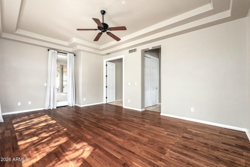 Primary bedroom with door to patio