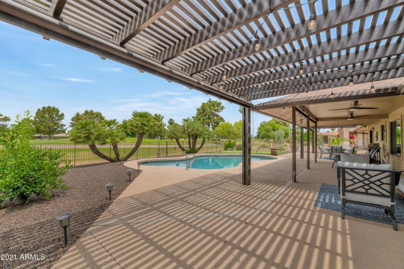 COVERED PATIO W ROLL DOWN SUN SHADES